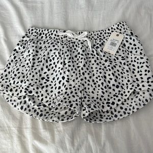 white and black polkadot billabong shorts